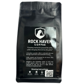 Black coffee bag with 'Rock Haven Coffee' branding and text on a white background